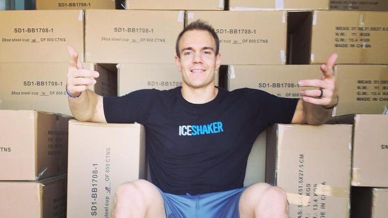 Chris Gronkowski sitting on Ice Shaker boxes