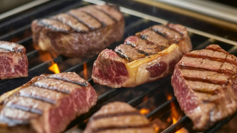 New York strip steaks on the grill