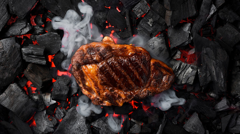 A ribeye cap on charcoal