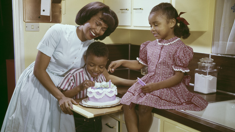 Family in kitchen in 1970s
