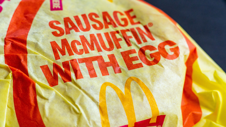 A Sausage McMuffin with Egg sits in its wrapper.