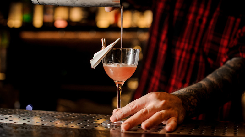 Pouring paper plane cocktail