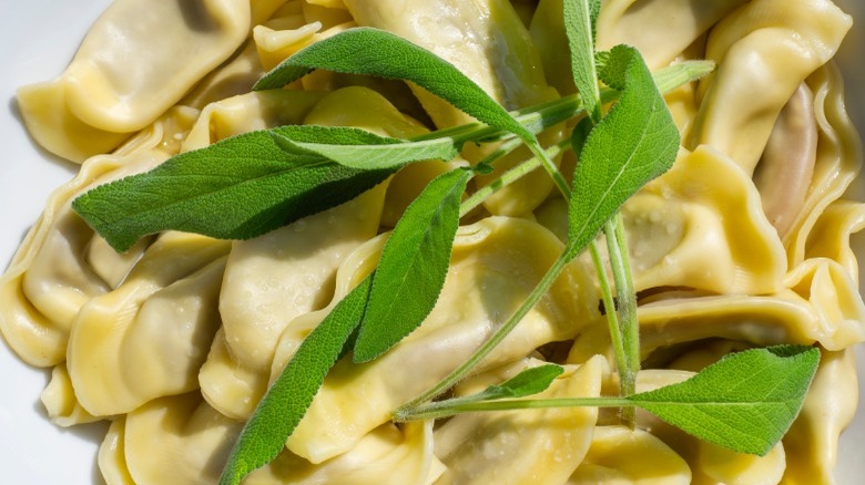Cooked casoncelli topped with a fresh sage
