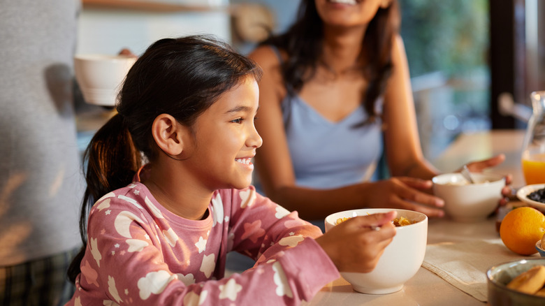 Child eating something out of a bowl