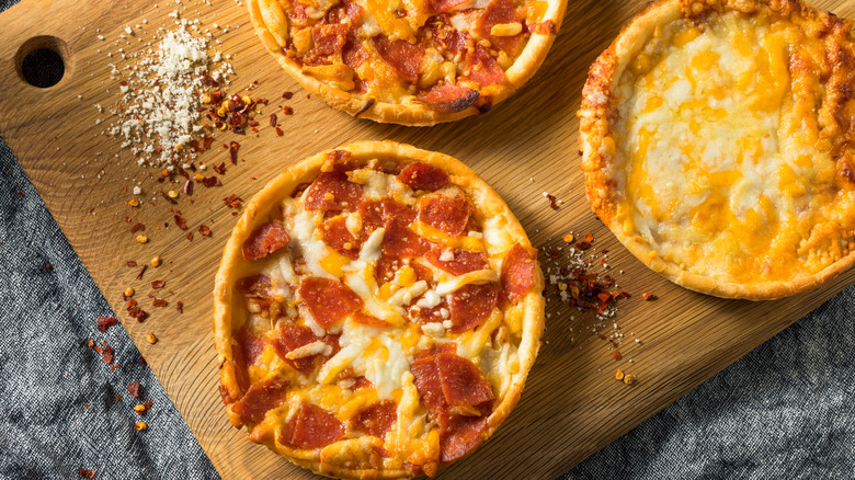 Pizzas on a wooden board