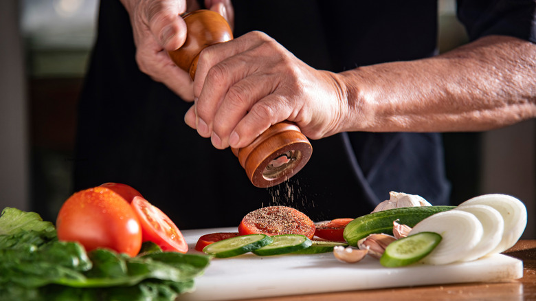 Fresh black pepper on a tomato
