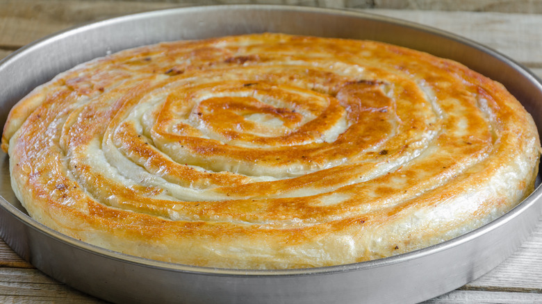 Metal pie pan on wooden surface