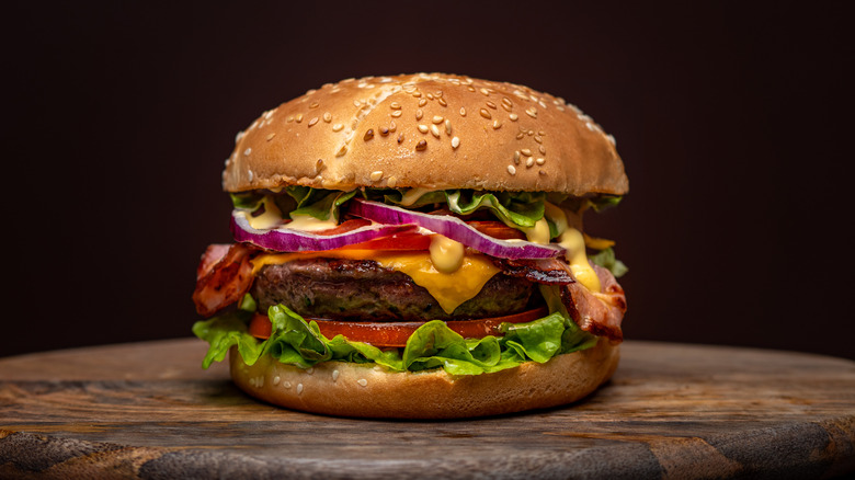 Beefburger with bacon, onions, and lettuce