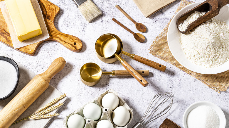 A bowl of flour sitting on a baking scale