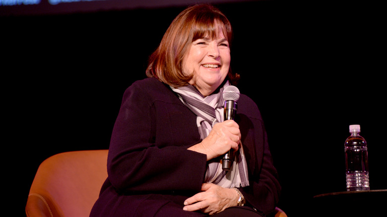 Ina Garten smiling into a microphone
