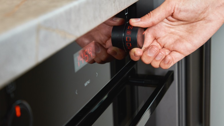Hand turning oven dial