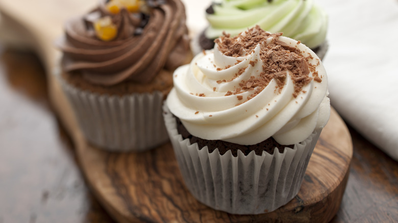 Three cupcakes on serving tray