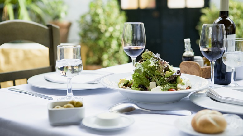 Salad and glasses of wine
