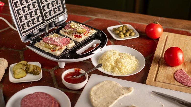 Pizza ingredients in waffle maker