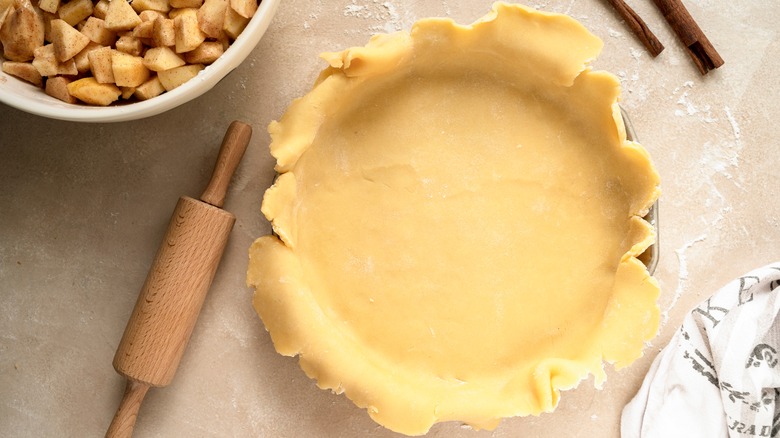 Pie dough rolled and placed in pan for apple pie