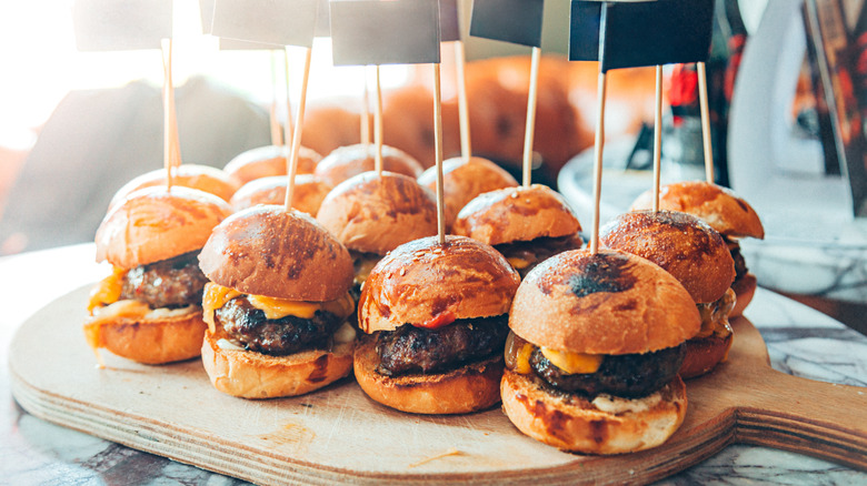 mini cheeseburgers on tray