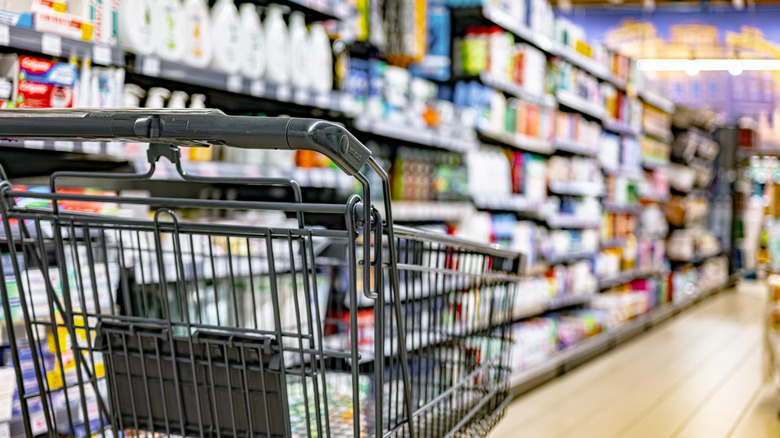 Shopping cart in a grocery store aisle