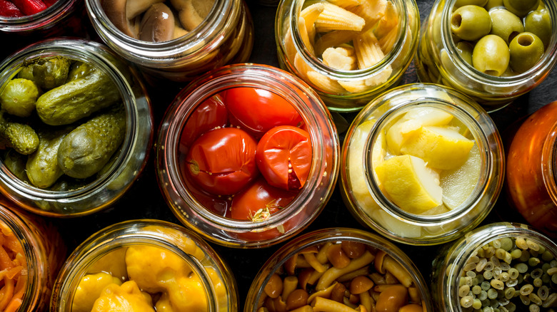 Glass jars of pickled vegetables