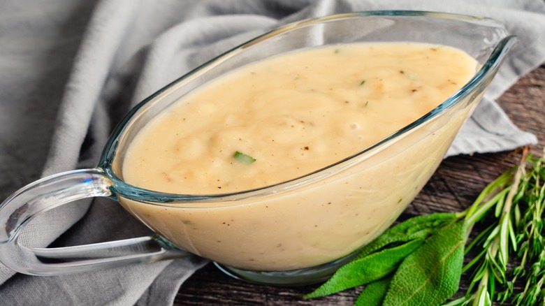 light colored gravy in a gravy boat