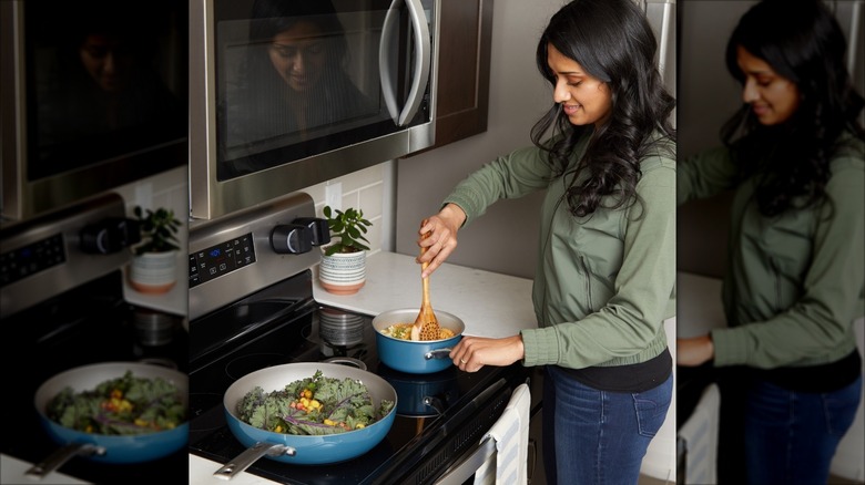 Inirv Ome founder Akshita Iyer cooking at stovetop
