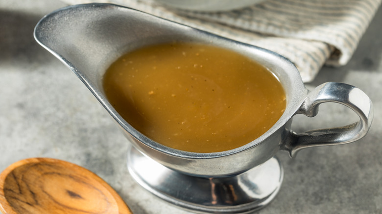 Brown gravy in a gravy boat.