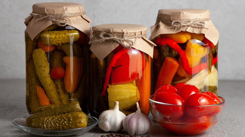 A variety of pickles vegetables in a jar.