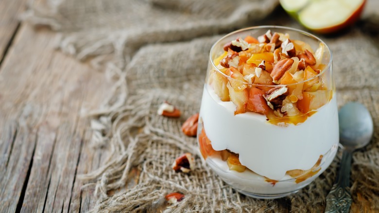 Fruit salad with Greek yogurt in glass