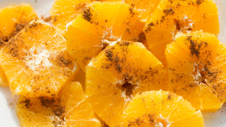 Sliced oranges with sugar and cinnamon