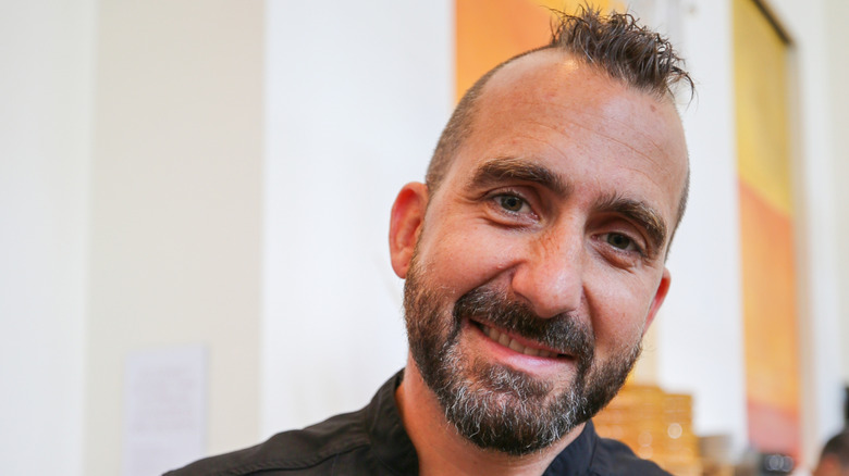 Chef Marc Forgione poses at a public event