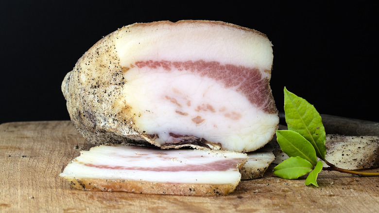 Pancetta on a wooden cutting board