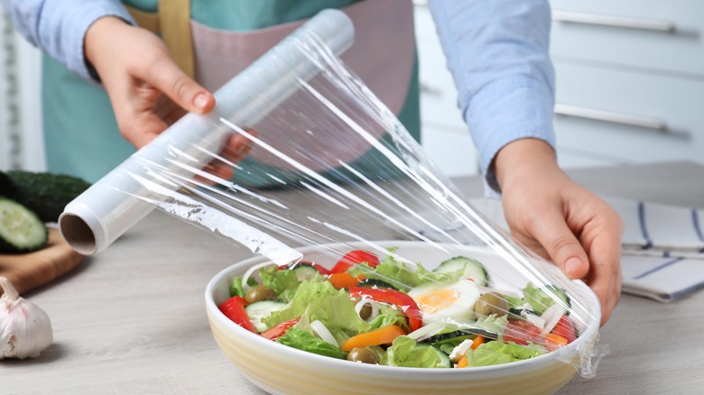 Plastic wrap covering salad