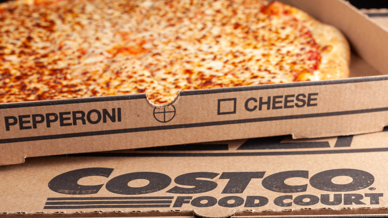 Costco cheese pizza in a Costco food court box
