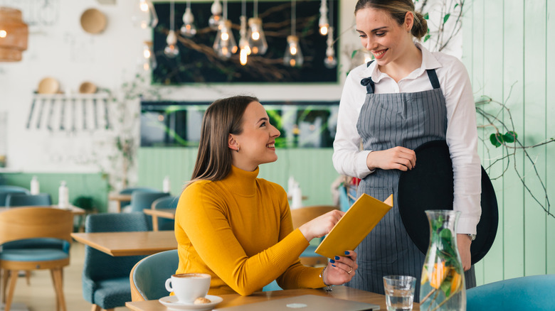 woman ordering food in a restaurant