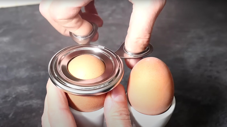 scissors-shaped egg toppers cutting egg
