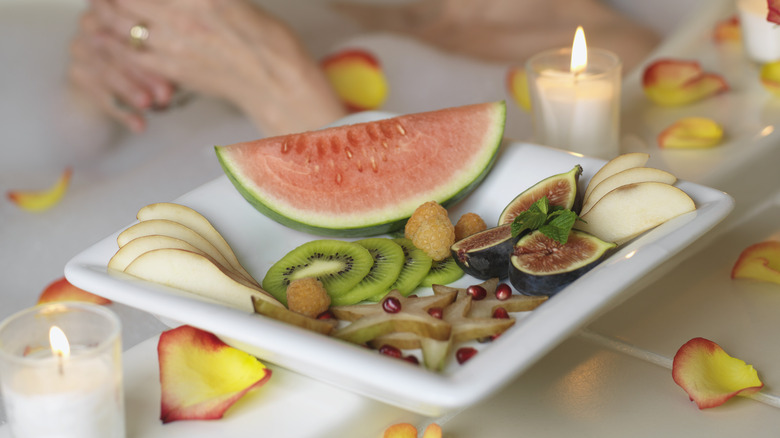 fruit propped on bathtub edge