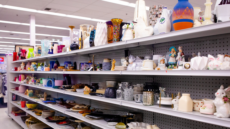 aisle in a thrift store featuring ceramics