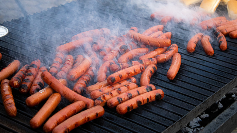 hot dogs on a grill