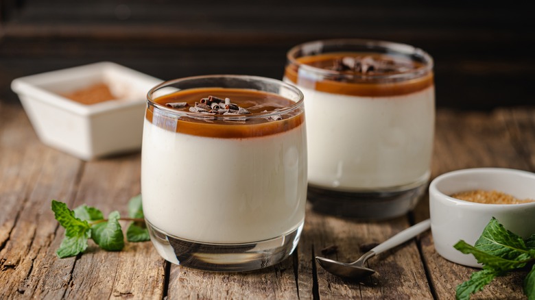 Panna cotta desserts in glasses with caramel topping