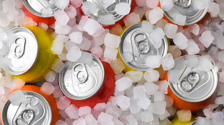 A variety of different types of sodas in ice