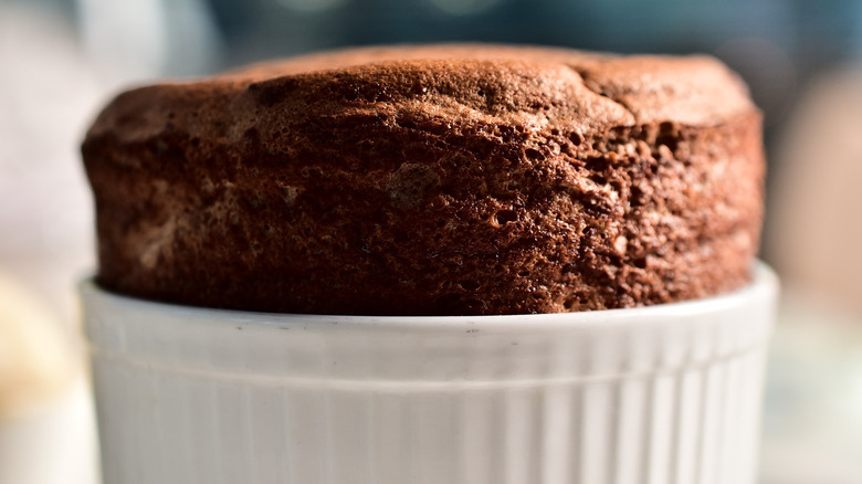 chocolate soufflé in white ramekin