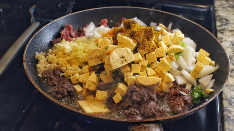 skillet full of pie filling ingredients