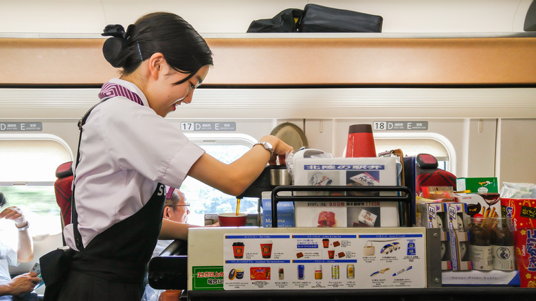 Vendor and trolley on bullet train