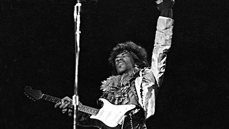 Jimi Hendrix performing on stage