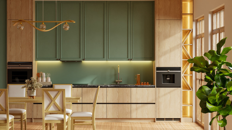 A warm green and beige kitchen