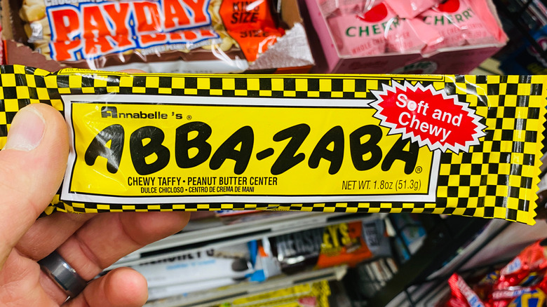 Hand holding an Abba-Zaba candy bar