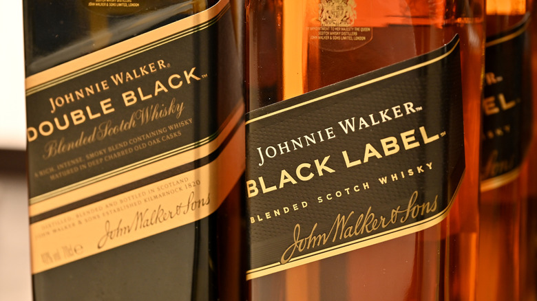 A bottle of Johnnie Walker Double Black and Black Label.