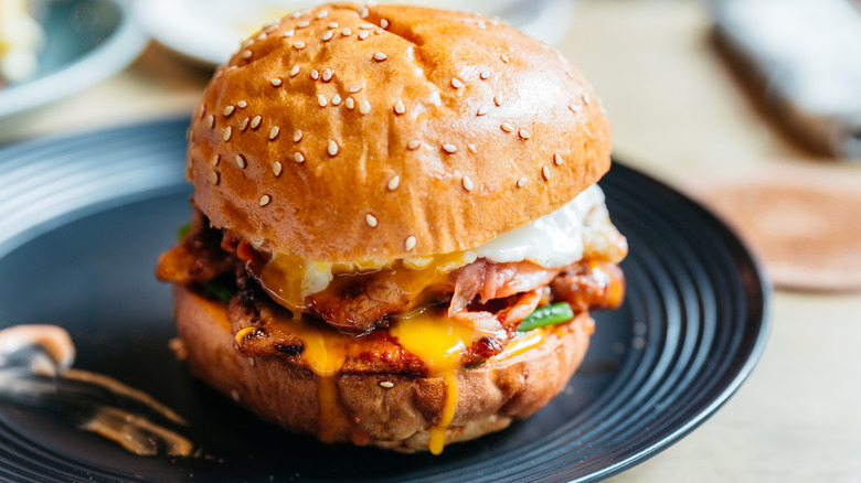 Sesame seed topped bun with gooey fried egg