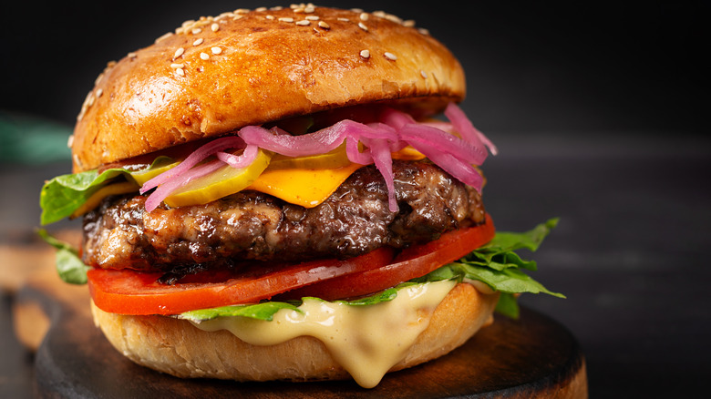 Juicy beef hamburger with onions and cheese