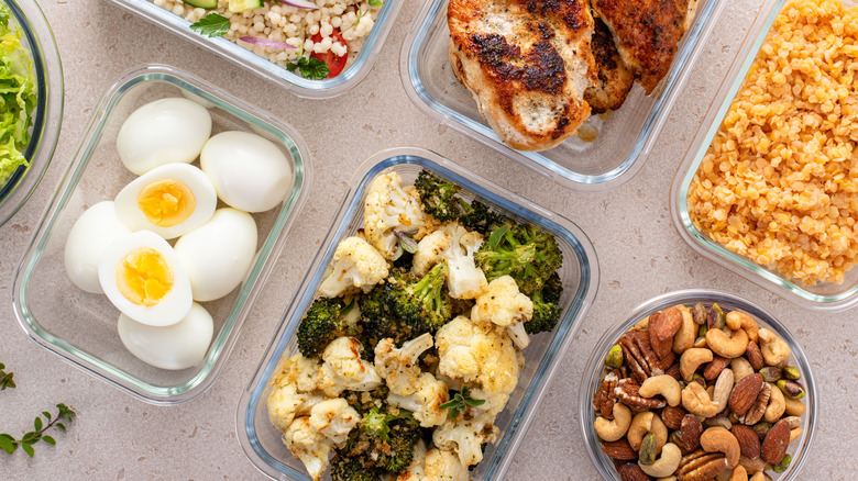 A variety of meal prep, including roasted broccoli and cauliflower.