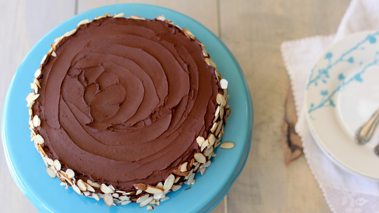 A Queen of Sheba cake on a blue cake stand